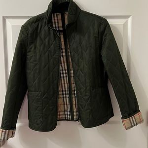 Burberry woman green quilted jacket.